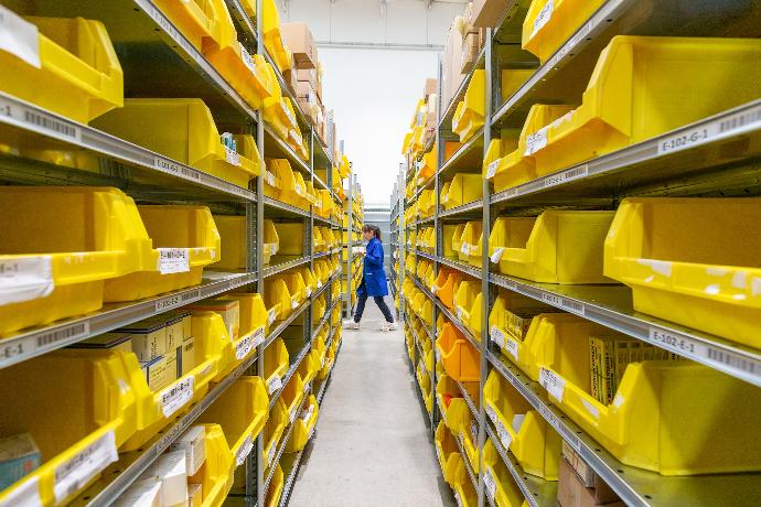 yellow plastic crates on white floor tiles